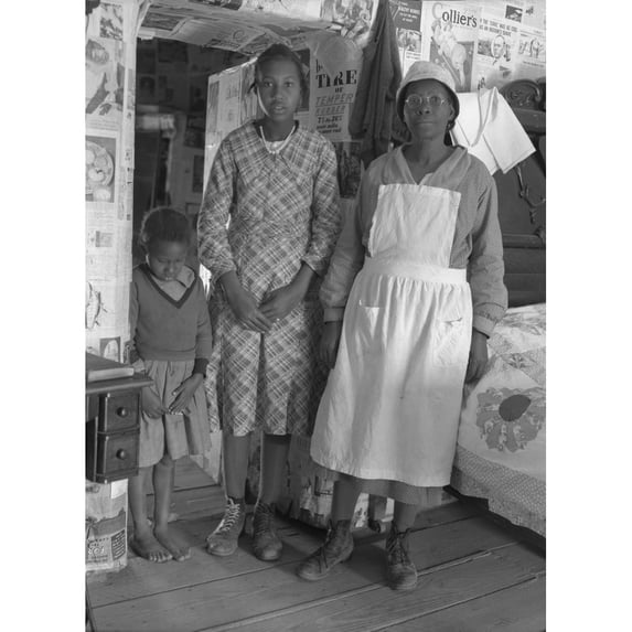 African American Mother With Her Two Daughters Living In Primitive Conditions As Plantation Tenants In Gees Bend History