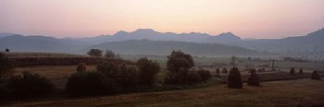 Agricultural field with a mountain range in the background Transylvania Romania Canvas Art - Panoramic Images (18 x 6)