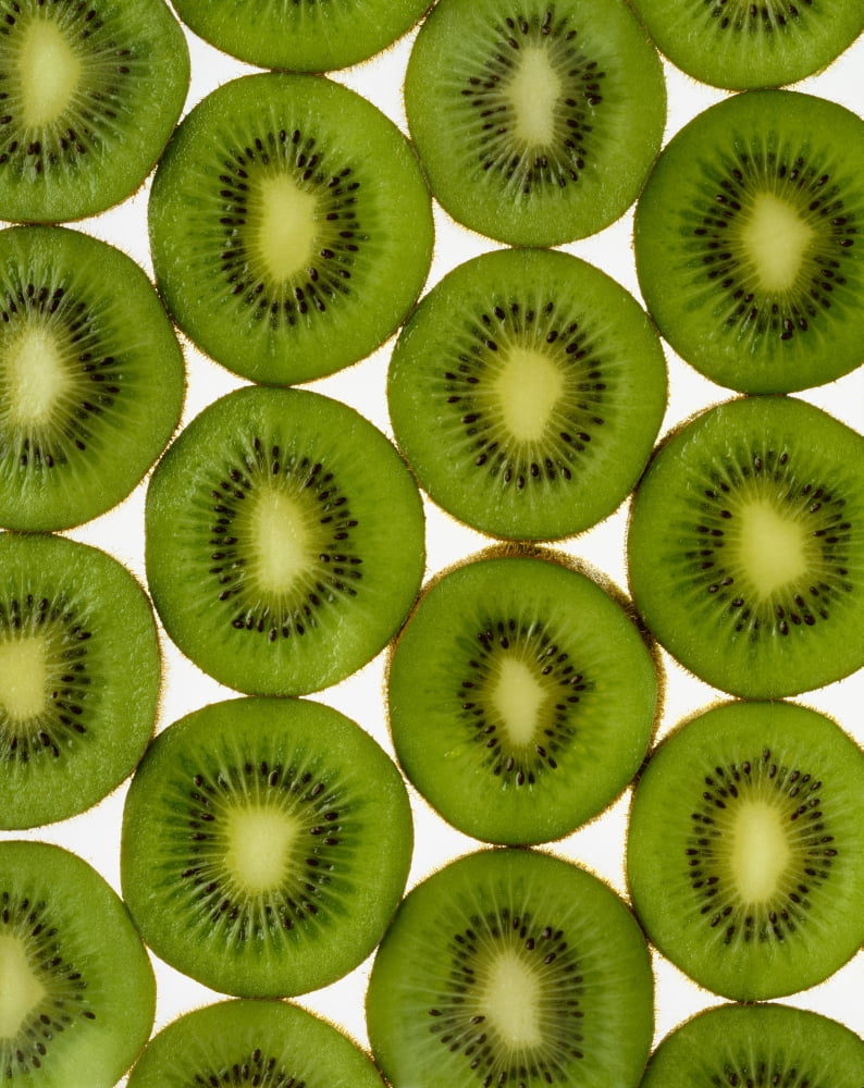 Agriculture - Kiwi slices arranged in rows and backlit studio Version 2 Canvas Art - Ed Young  Design Pics (26 x 34)
