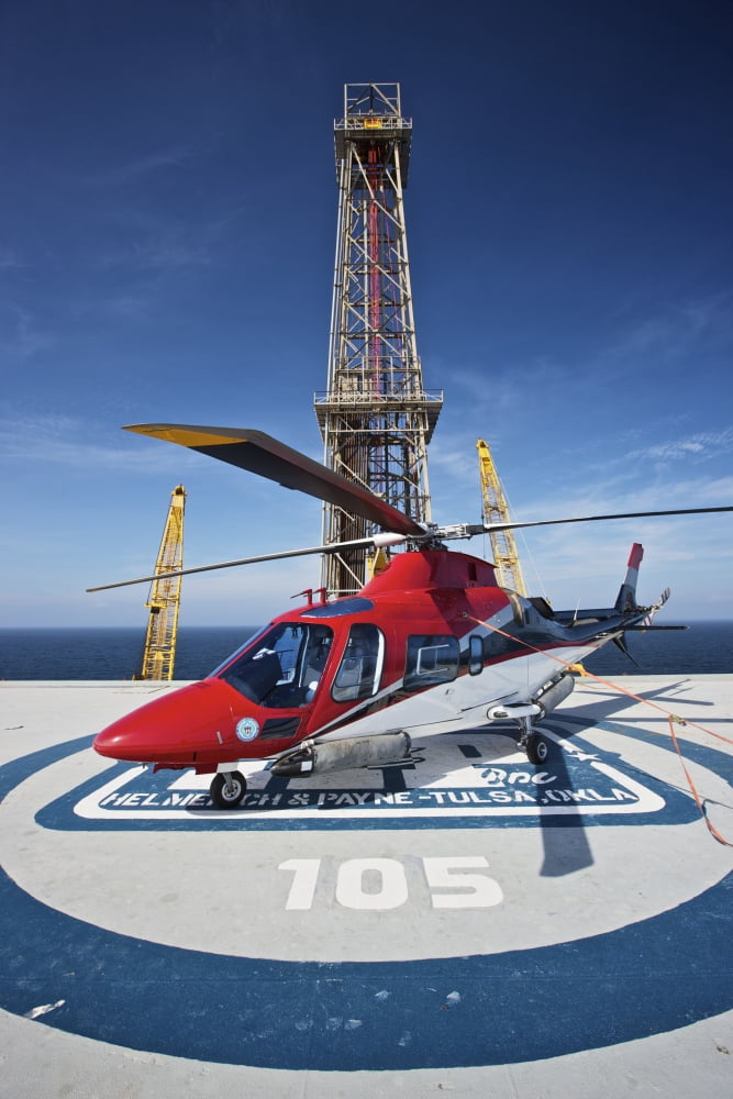 AgustaWestland AW109E utility helicopter on the helipad of an oil rig Canvas Art - Terry MooreStocktrek Images (12 x 18)