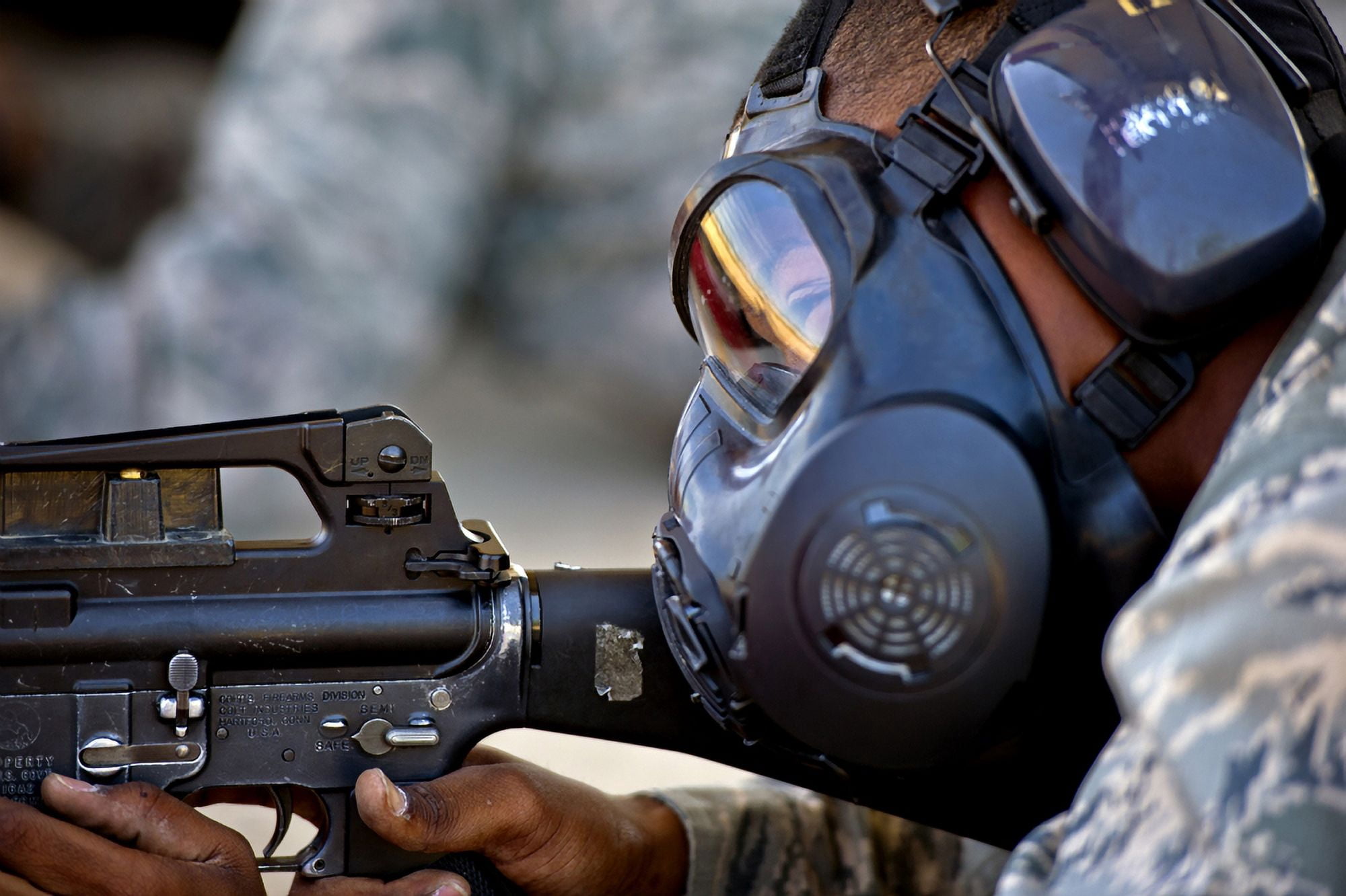 Air Force Basic Military Training trainee fires at his target while wearing his gas mask Canvas Art - Stocktrek Images (35 x 23)