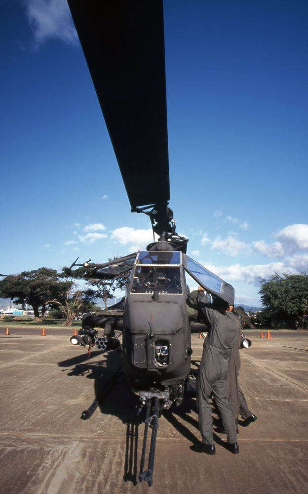 Air crewmen secure an AH-1 Cobra attack helicopter Canvas Art - Michael WoodStocktrek Images (22 x 36)