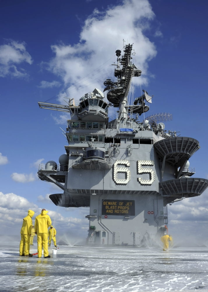 Air department Sailors test the sprinkler system on the flight deck of the USS Enterprise Canvas Art - Stocktrek Images (24 x 34)