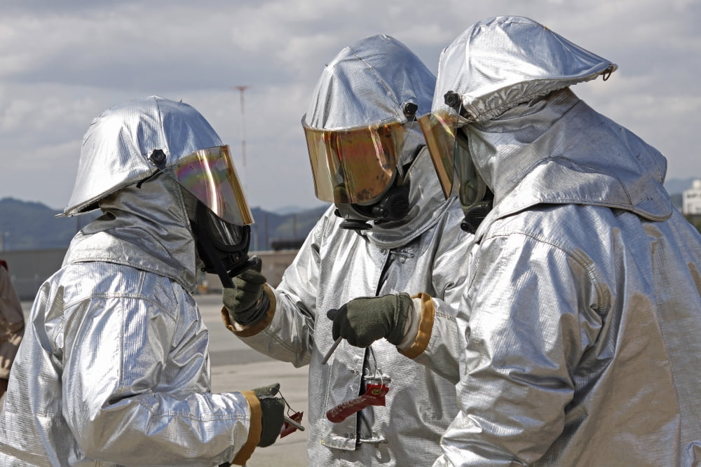 Aircraft Rescue Firefighter Marines look over each others bunker suits Canvas Art - Stocktrek Images (34 x 23)