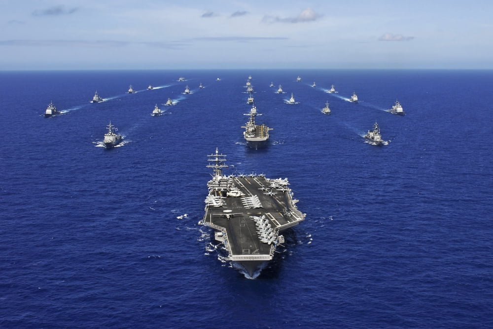 Aircraft carrier USS Ronald Reagan transits the Pacific Ocean with a fleet of ships Canvas Art - Stocktrek Images (34 x 23)