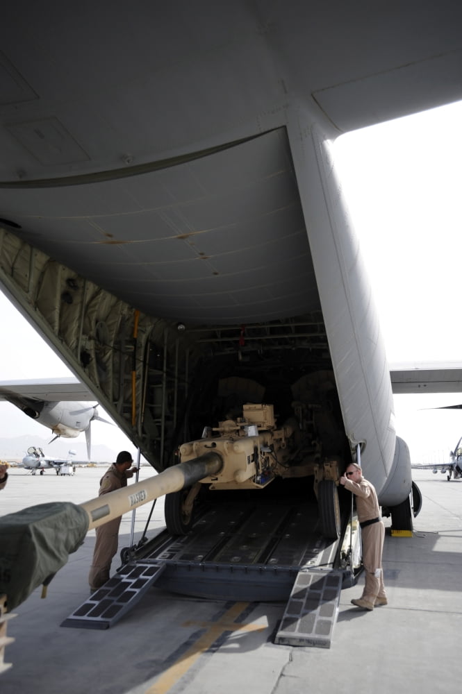 Aircrew load an M777 A2 Howitzer onto a US Air Force C-130J Canvas Art - Stocktrek Images (23 x 34)
