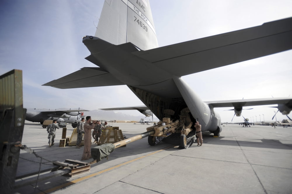 Aircrew load an M777 A2 Howitzer onto a US Air Force C-130J Canvas Art - Stocktrek Images (34 x 23)