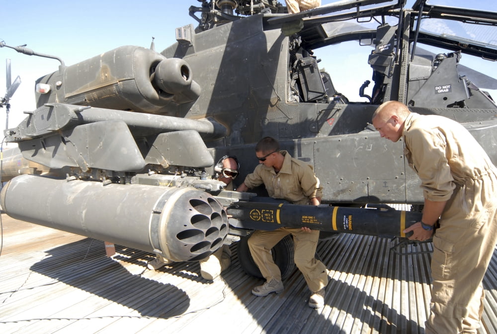 Aircrew loading an AGM-114 Hellfire missile onto an Apache helicopter Canvas Art - Andrew ChittockStocktrek Images (17 x 12)