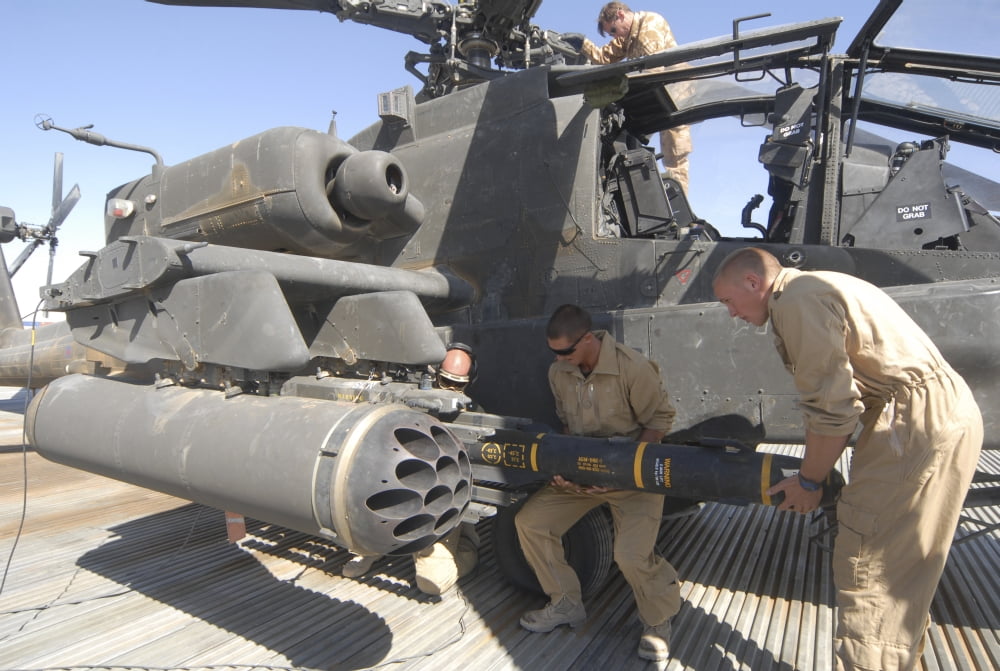 Aircrew loading an AGM-114 Hellfire missile onto an Apache helicopter Canvas Art - Andrew ChittockStocktrek Images (17 x 12)