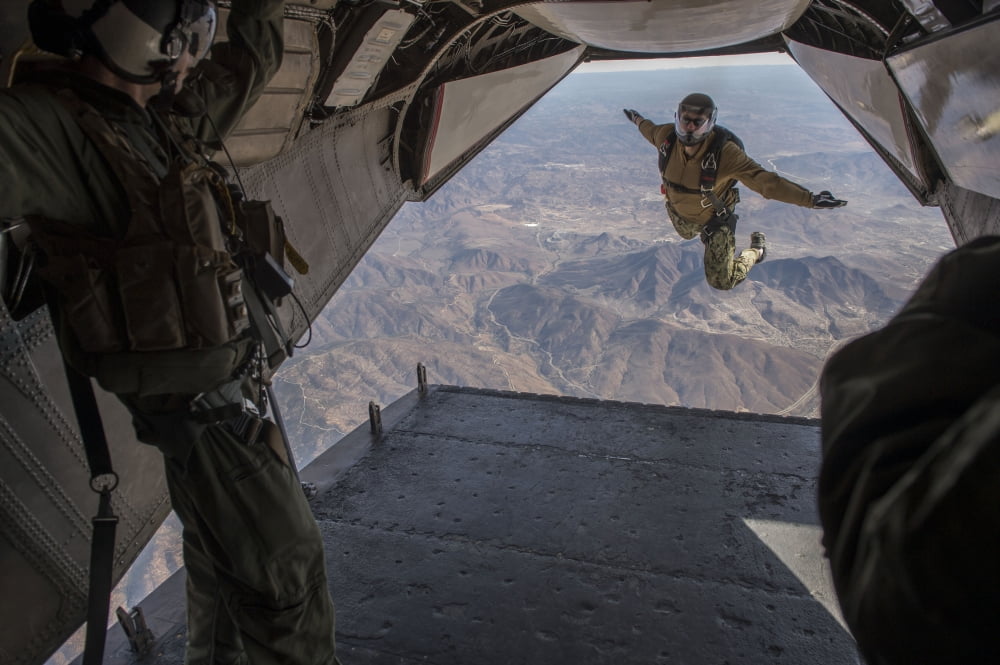 Aircrewman jumps from a C2-A Greyhound Canvas Art - Stocktrek Images (34 x 23)