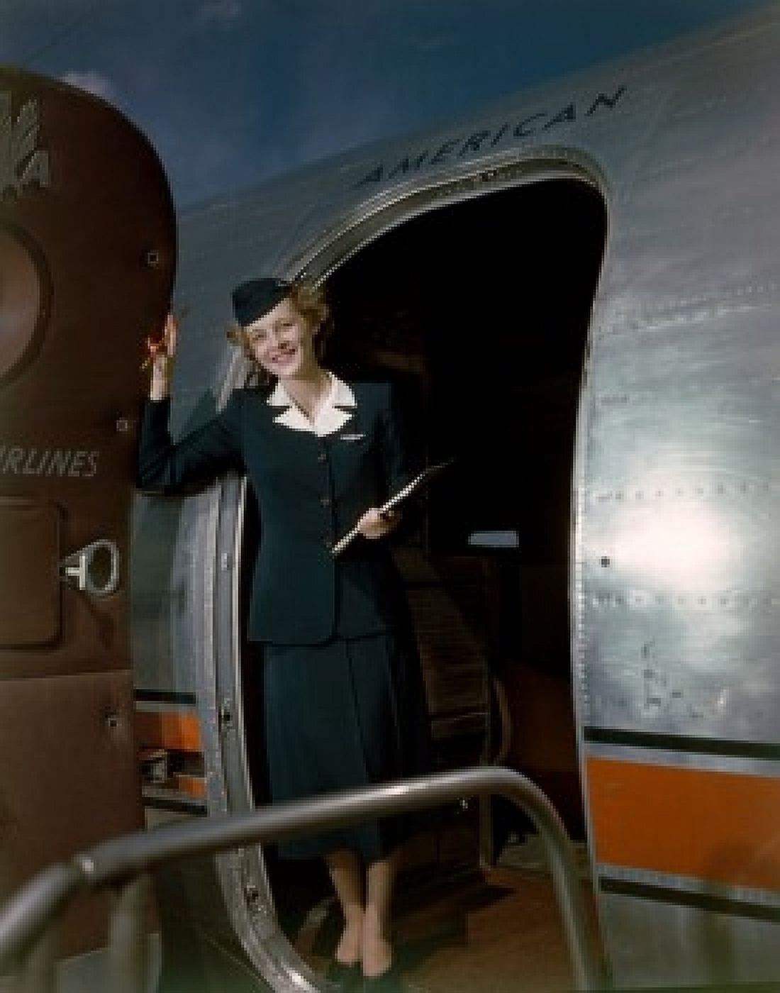 Airline hostess standing in doorway of plane Canvas Art - (24 x 36)