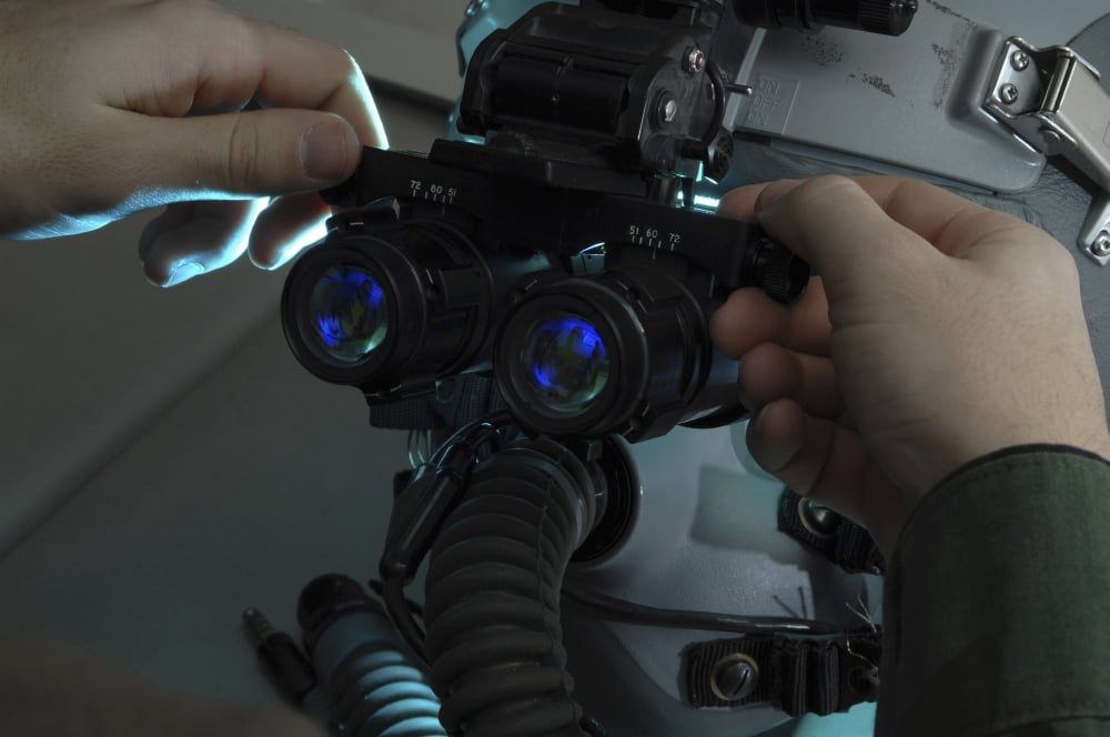Airman adjusts the eyespan on a pair of night vision goggles Canvas Art - Stocktrek Images (34 x 23)