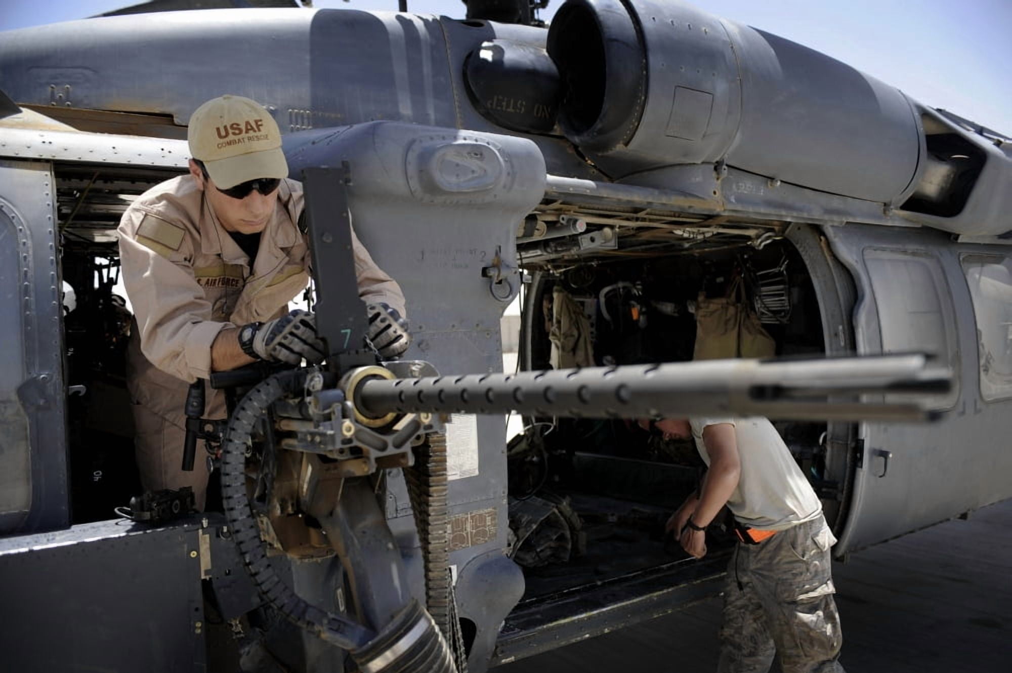 Airman conducts a preflight inspection of a 50 caliber machine gun Canvas Art - Stocktrek Images (34 x 23)