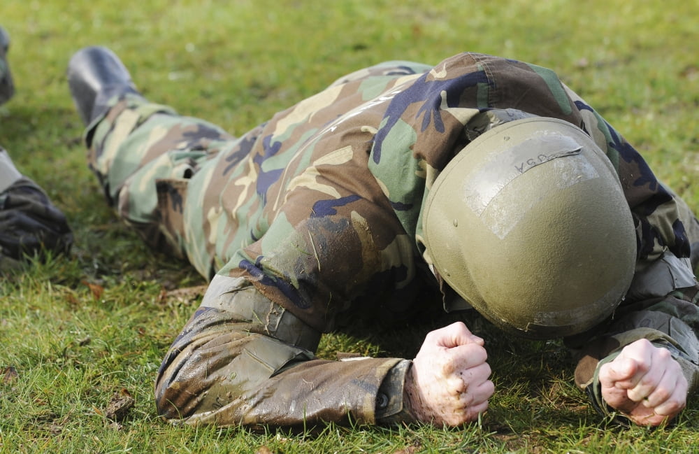 Airman crawls through a wet field during individual core competency skills training Canvas Art - Stocktrek Images (35 x 23)