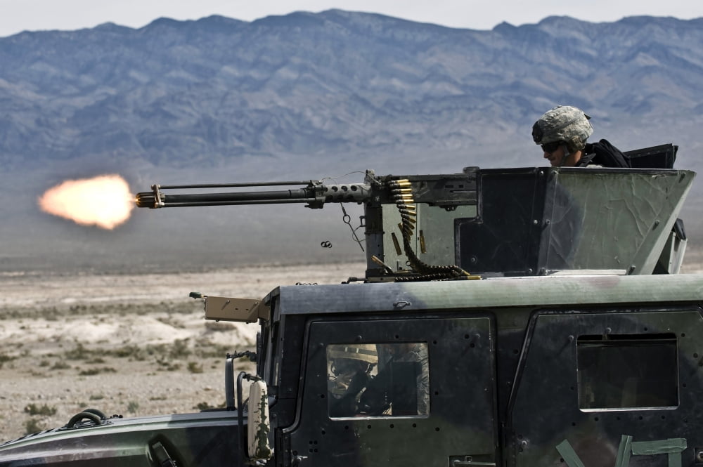 Airman fires a 50 caliber heavy machine gun Canvas Art - Stocktrek Images (34 x 23)