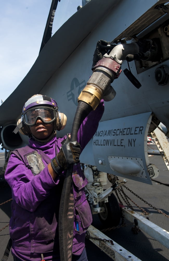 Airman fuels an FA-18C Hornet Canvas Art - Stocktrek Images (23 x 35)