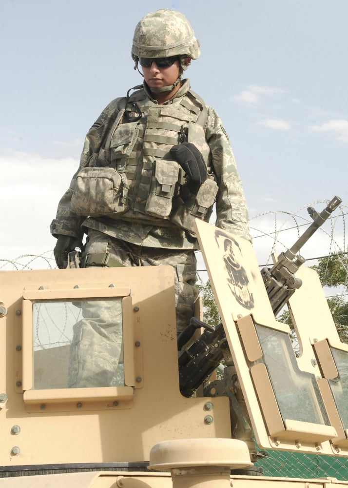 Airman prepares for a patrol and to man an M249 automatic rifle Canvas Art - Stocktrek Images (24 x 34)