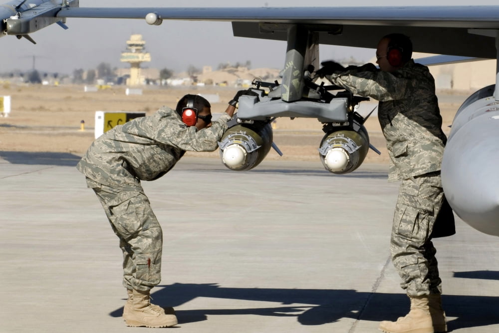 Airmen inspect F-16 Fighting Falcon munitions prior to take off Canvas Art - Stocktrek Images (34 x 23)