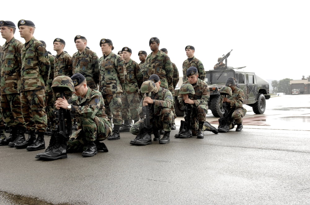 Airmen kneel in place for fellow Airmen during the Last Guard Mount Canvas Art - Stocktrek Images (34 x 23)