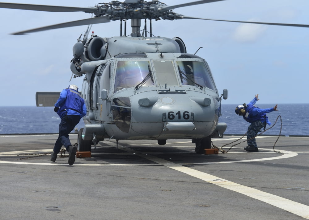 Airmen remove the chocks and chains from an MH-60S Sea Hawk Canvas Art - Stocktrek Images (34 x 24)