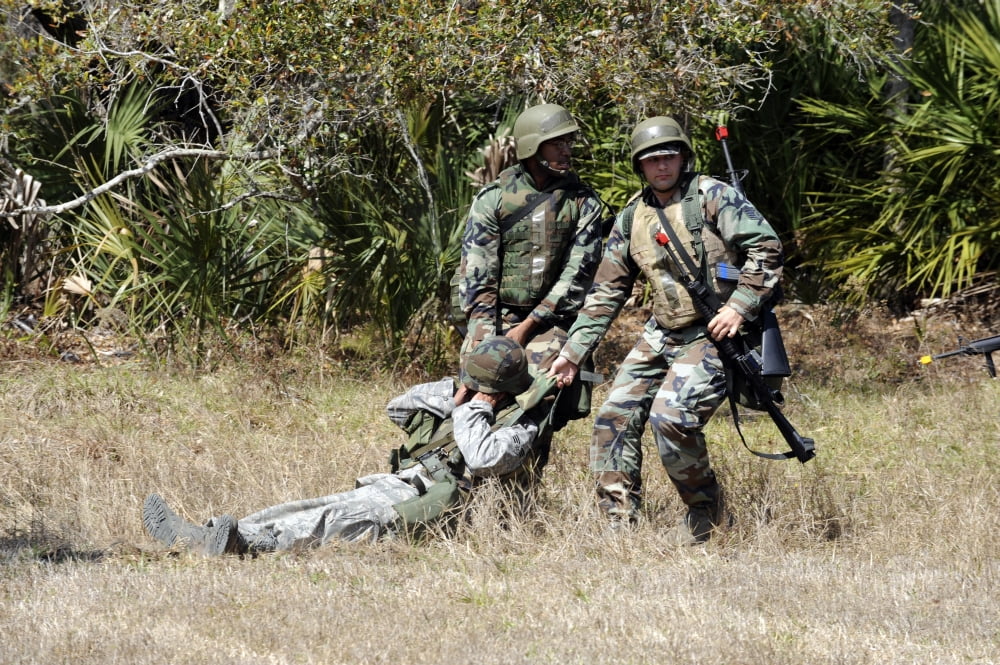Airmen utilize the clothes pull to get a casualty to safety Canvas Art - Stocktrek Images (34 x 23)