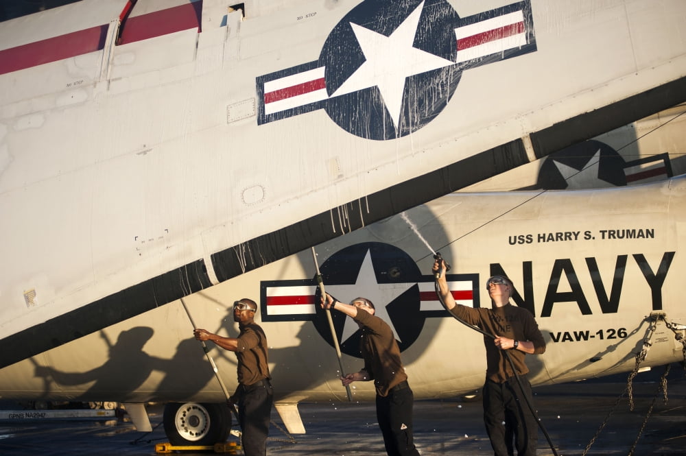 Airmen wash an E-2C Hawkeye aircraft Canvas Art - Stocktrek Images (34 x 23)
