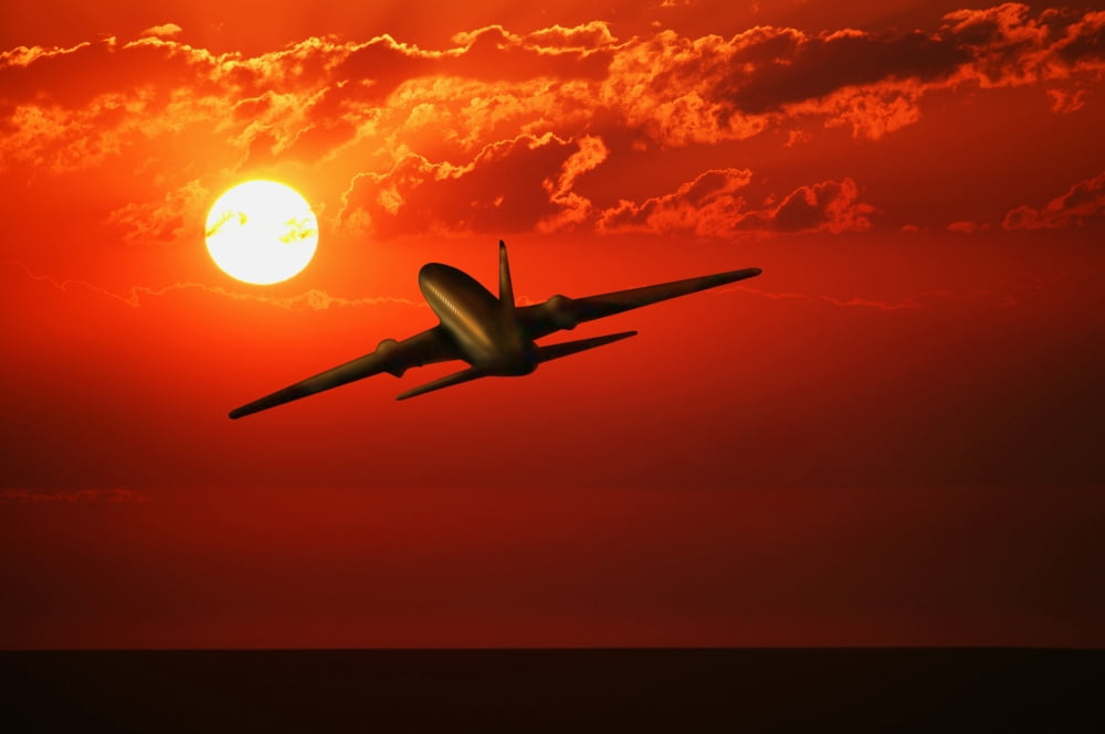 Airplane Flying In SunriseSunset Canvas Art - Don Hammond Design Pics (17 x 11)