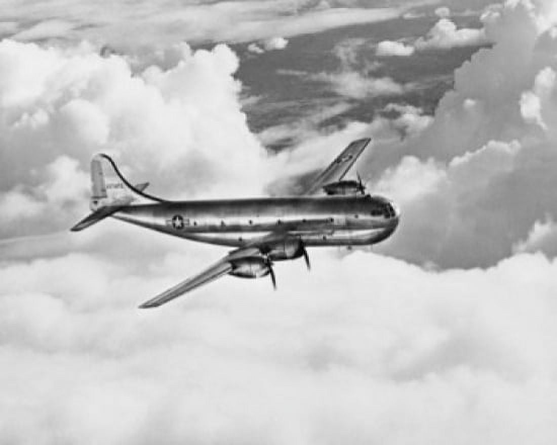Airplane in flight Canvas Art - (24 x 36)