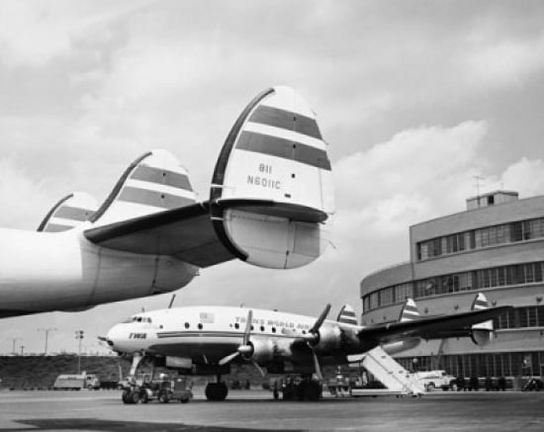 Airplanes in an airport Canvas Art - (18 x 24)