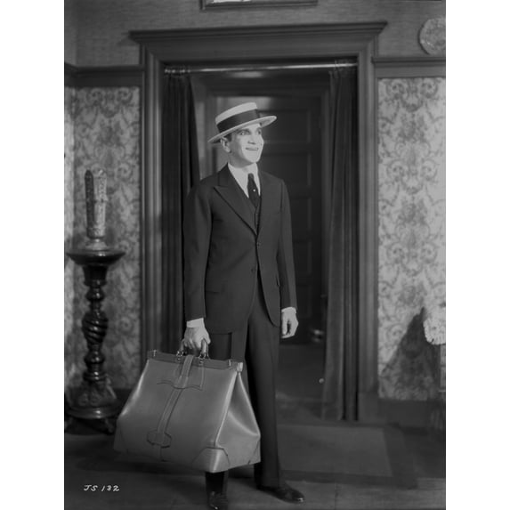 Al Jolson Leaving with a Big Bag wearing a Black Suit and a Hat Classic Movie Scene Photo Print (24 x 30)