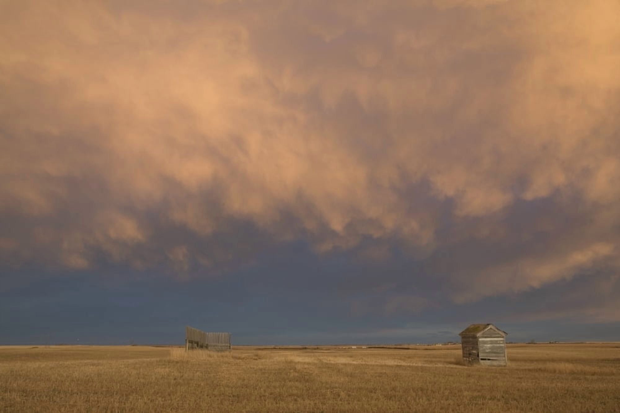 Alberta Canada A Wooden Shack On A Cut Wheat Field With A Dramatic Cloudy Sky At Sunset Canvas Art - Michael Interisano Design Pics (38 x 24)