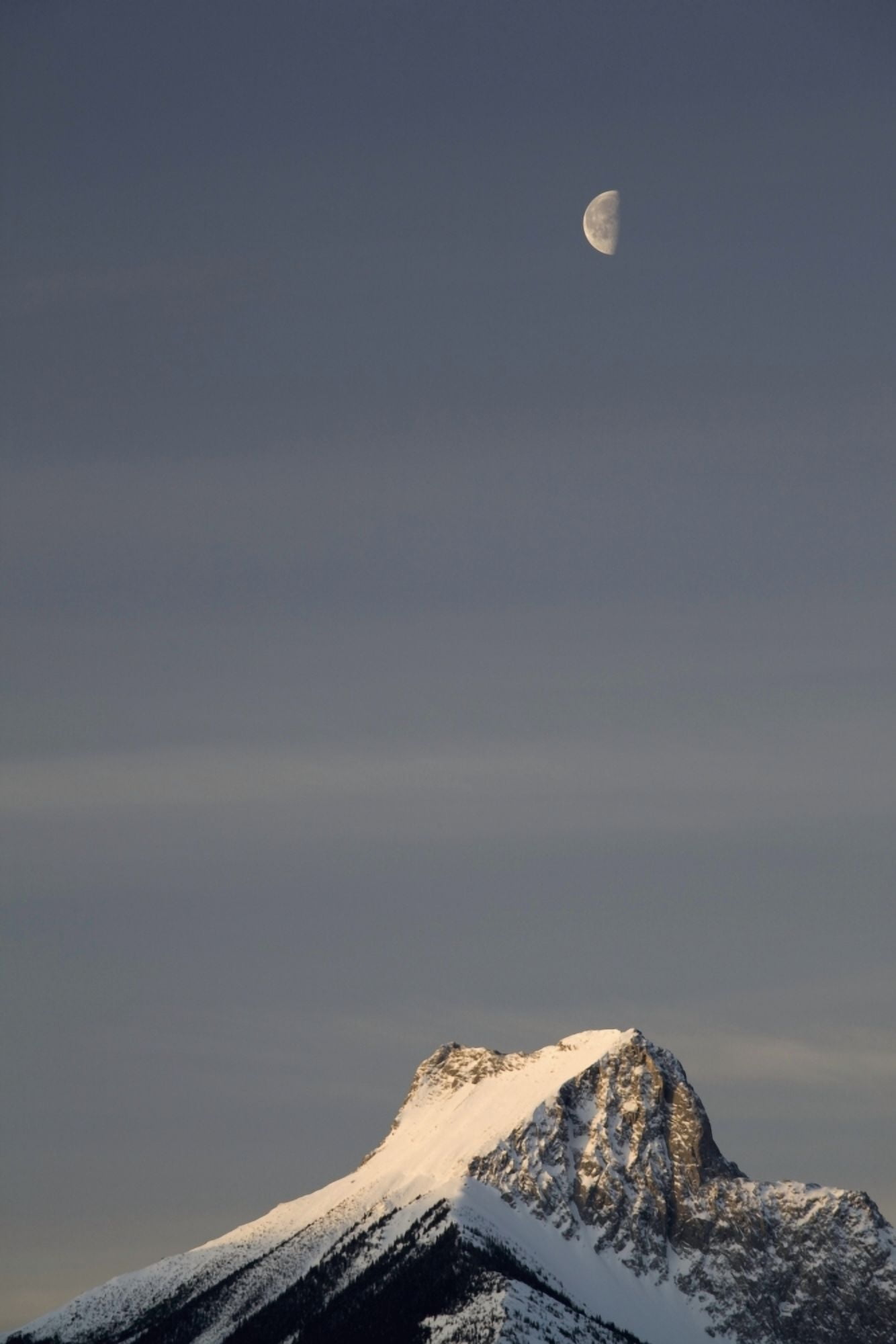Alberta Canada Snow Covered Mountain Peak And Half Moon At Sunrise In Kananaskis Country Canvas Art - Michael Interisano Design Pics (13 x 20)