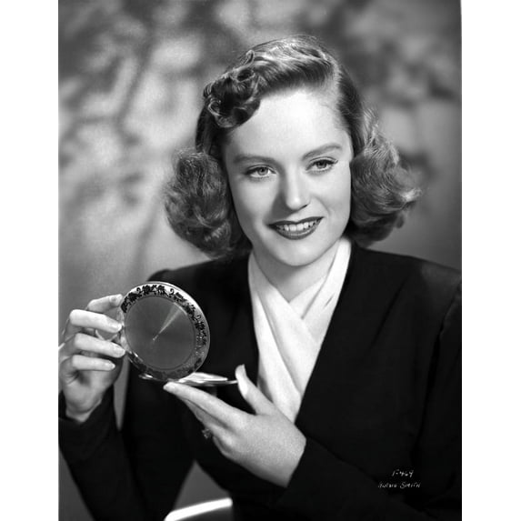 Alexis Smith smiling while Holding a Make up Kit Photo Print (24 x 30)
