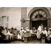 Algiers: Cafe./Ngroup Of Algerian Men Seated Outside A Cafe, With Bird Cages Hanging At The Entrance, In Algiers. Photochrome, C1899. Poster Print by  (24 x 36)