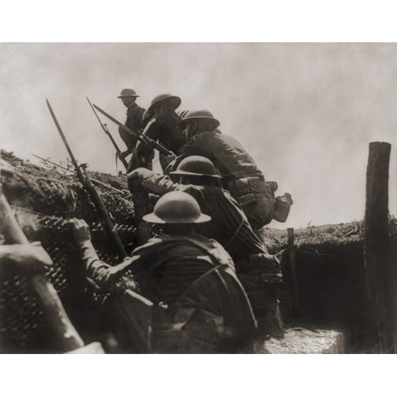 Allied Soldiers Climb Out Of The Defensive Trench To Engage In Battle On The Western Front During World War I. Ca. 1917.