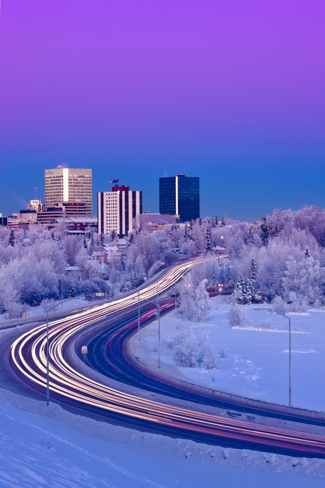 Alpenglow Over The Anchorage Skyline With The Lights From Traffic On Minnesota Blvd In The Foreground During Winter Southcentral Alaska Canvas Art - Kevin Smith Design Pics (12 x 18)