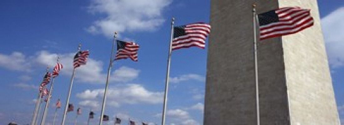 American flags in front of an obelisk Washington Monument Washington DC USA Canvas Art - Panoramic Images (18 x 7)