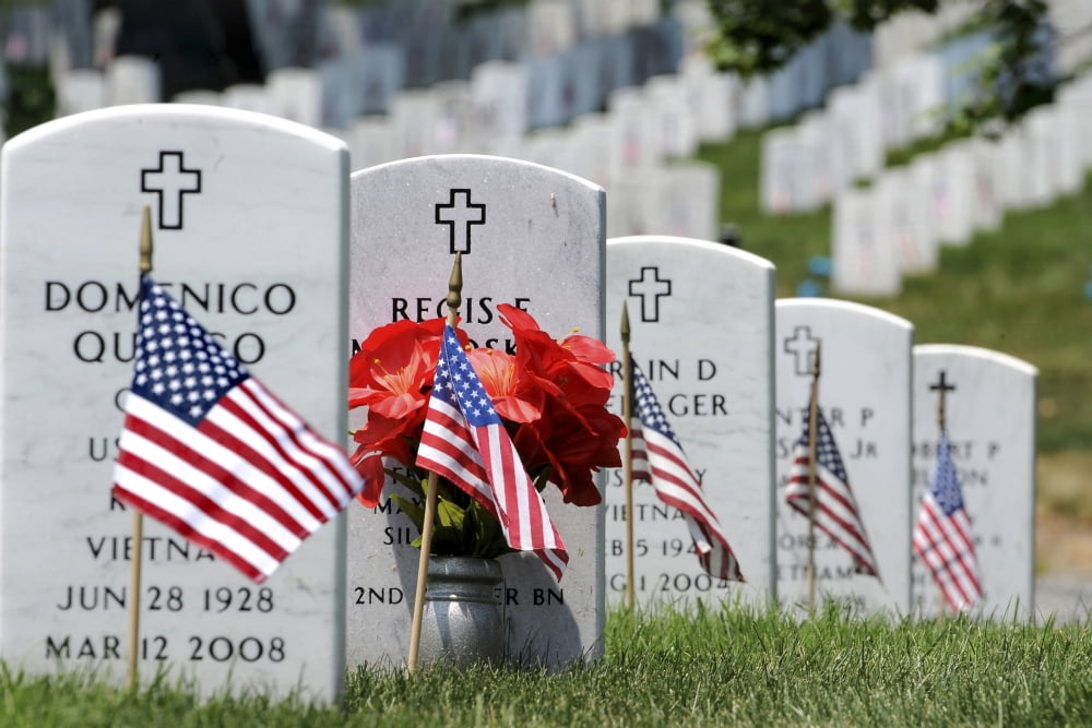 American flags placed in the front of headstones at Arlington National Cemetery Canvas Art - Stocktrek Images (35 x 23)