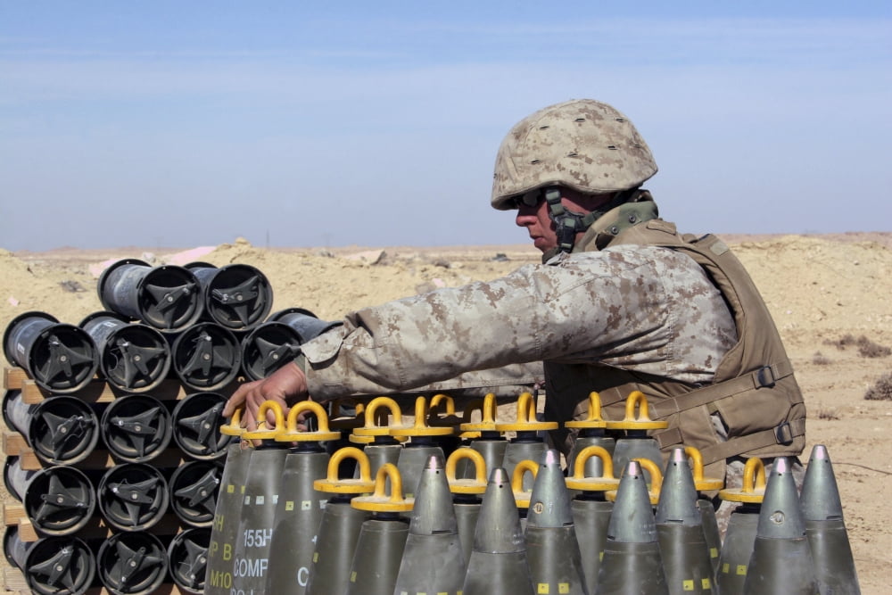 Ammunition team prepares 155 mm high-explosive artillery rounds Canvas Art - Stocktrek Images (34 x 23)