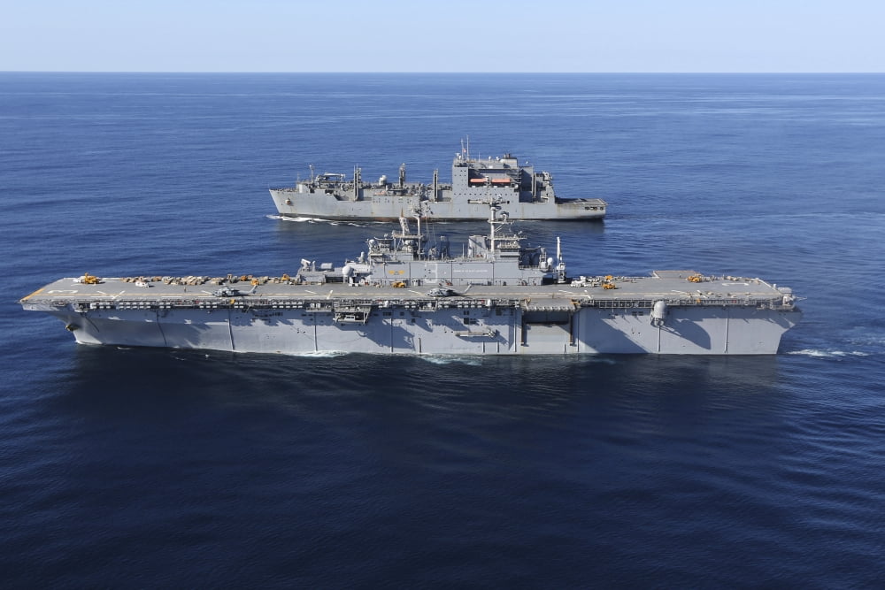 Amphibious assault ship USS Kearsarge alongside USNS Robert E Peary Canvas Art - Stocktrek Images (35 x 23)
