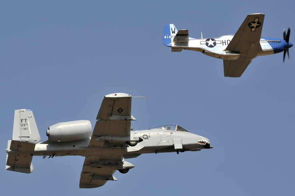 An A-10 Thunderbolt and a P-51 Mustang perform a heritage flight Canvas Art - Stocktrek Images (35 x 23)