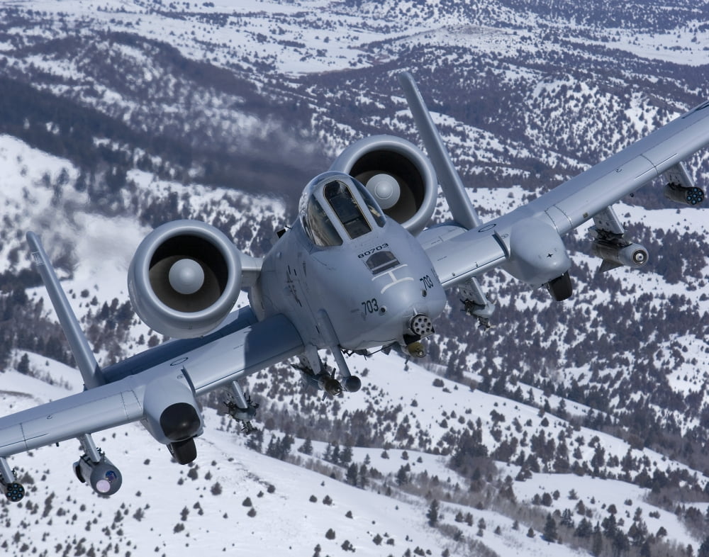An A-10C Thunderbolt flies over the snowy Idaho countryside Canvas Art - HIGH-G ProductionsStocktrek Images (17 x 13)
