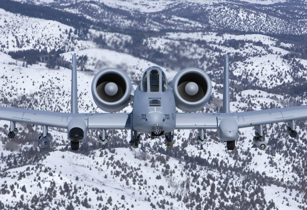 An A-10C Thunderbolt flies over the snowy Idaho countryside Canvas Art - HIGH-G ProductionsStocktrek Images (18 x 12)