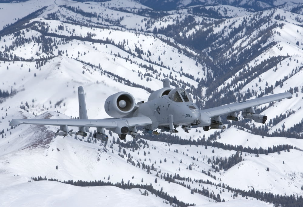 An A-10C Thunderbolt flies over the snowy Idaho countryside Canvas Art - HIGH-G ProductionsStocktrek Images (18 x 12)