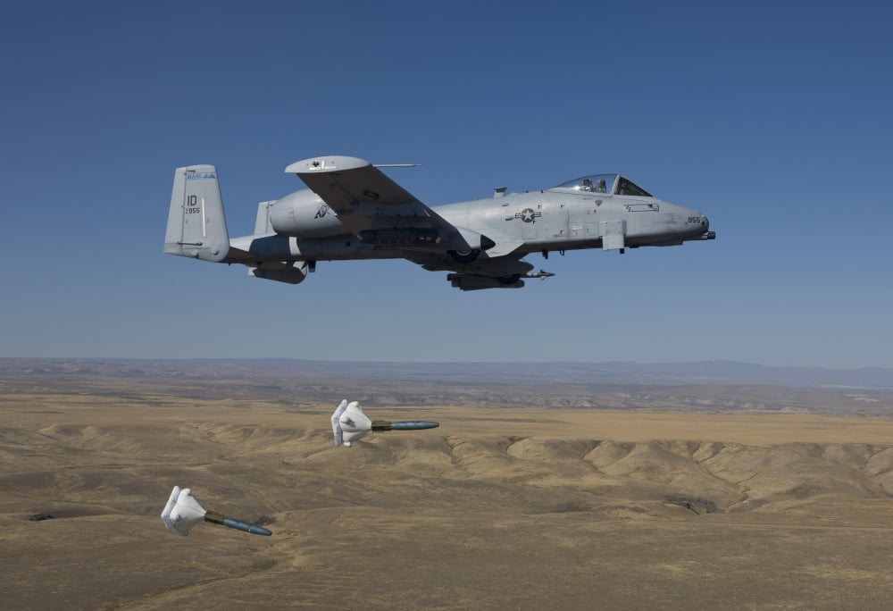 An A-10C Thunderbolt releases two High Drag BDU-50s over Idaho Canvas Art - HIGH-G ProductionsStocktrek Images (18 x 12)