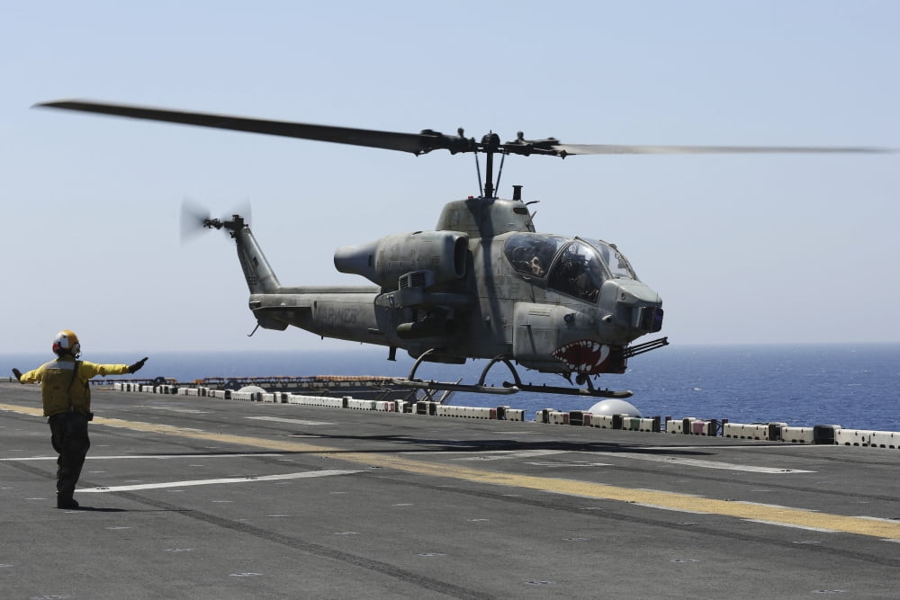 An AH-1W Super Cobra takes off from the flight deck of USS Kearsarge Canvas Art - Stocktrek Images (35 x 23)