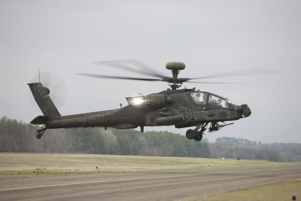 An AH-64 Apache helicopter in midair Conroe Texas Canvas Art - Terry MooreStocktrek Images (35 x 23)