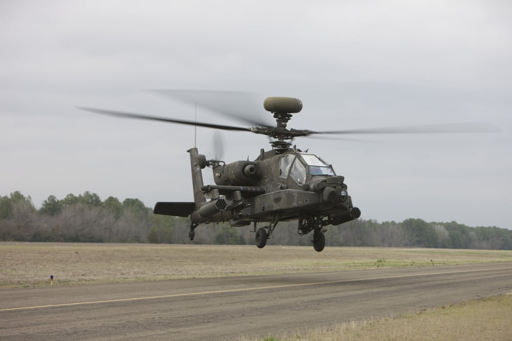 An AH-64 Apache helicopter in midair Conroe Texas Canvas Art - Terry MooreStocktrek Images (35 x 23)