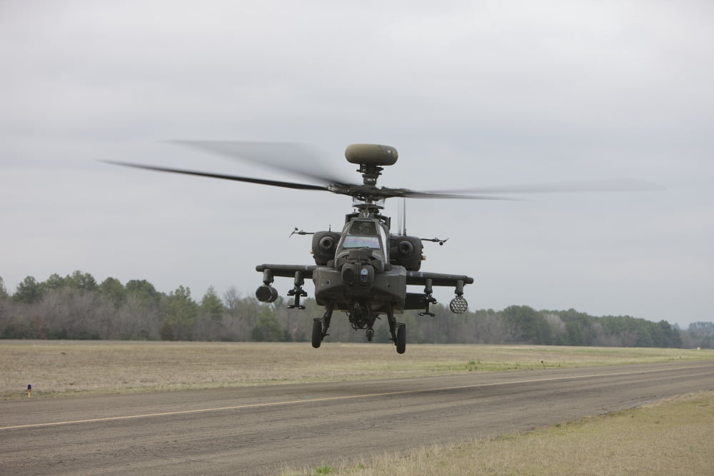 An AH-64 Apache helicopter in midair Conroe Texas Canvas Art - Terry MooreStocktrek Images (35 x 23)