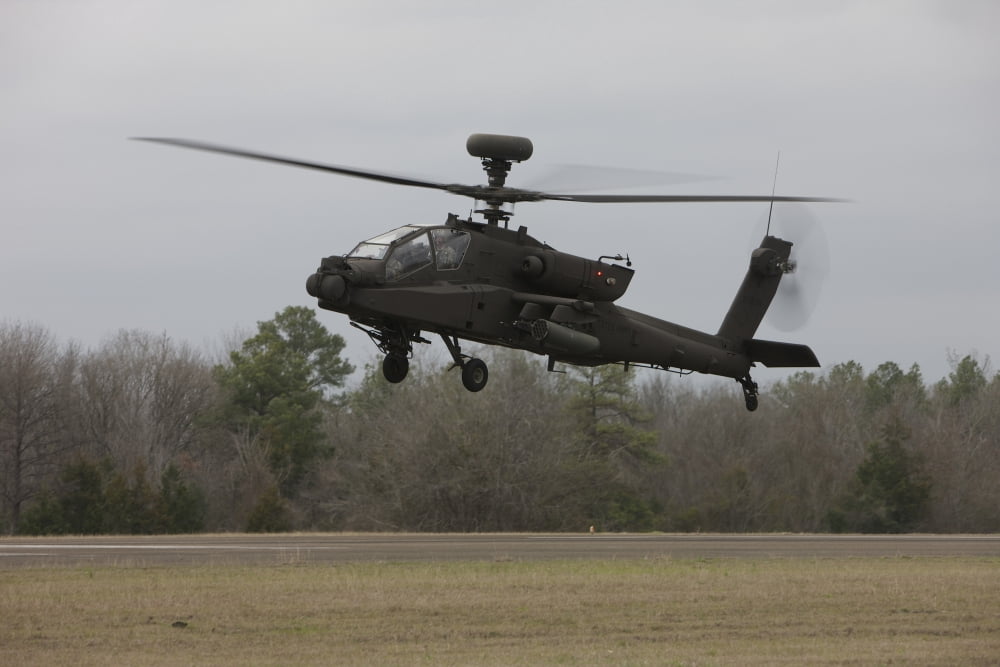 An AH-64 Apache helicopter in midair Conroe Texas Canvas Art - Terry MooreStocktrek Images (35 x 23)